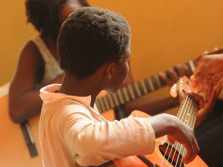 child playing the guitar
